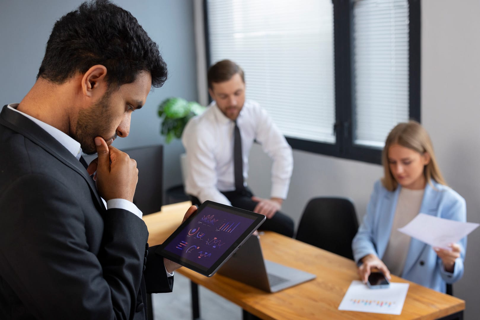 business person looking finance graphs 5 scaled