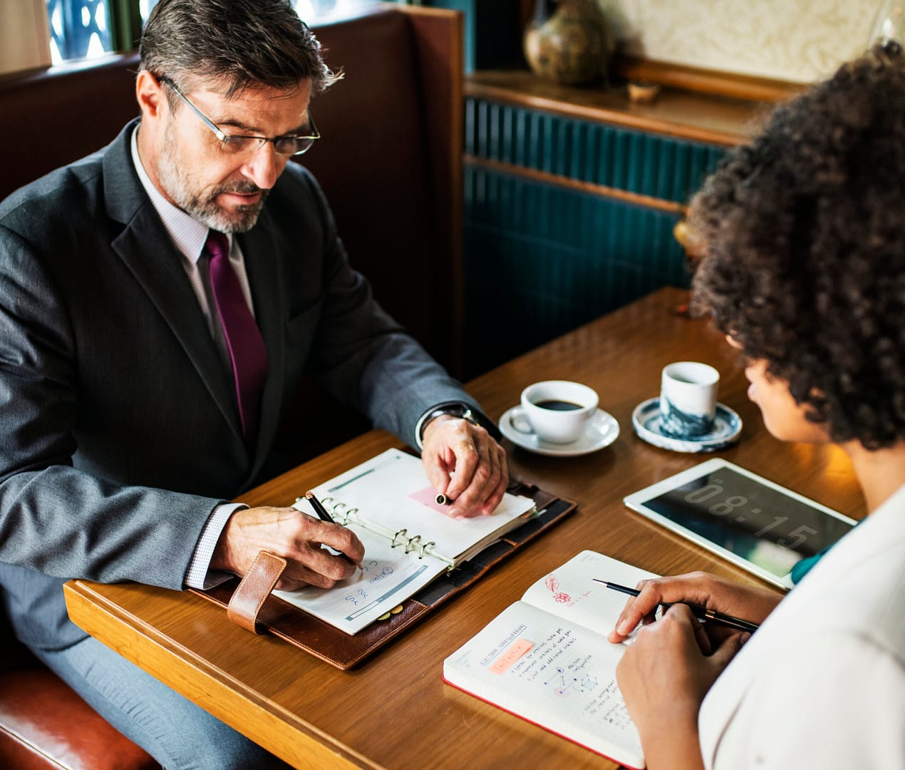 business people discussing cafe scaled