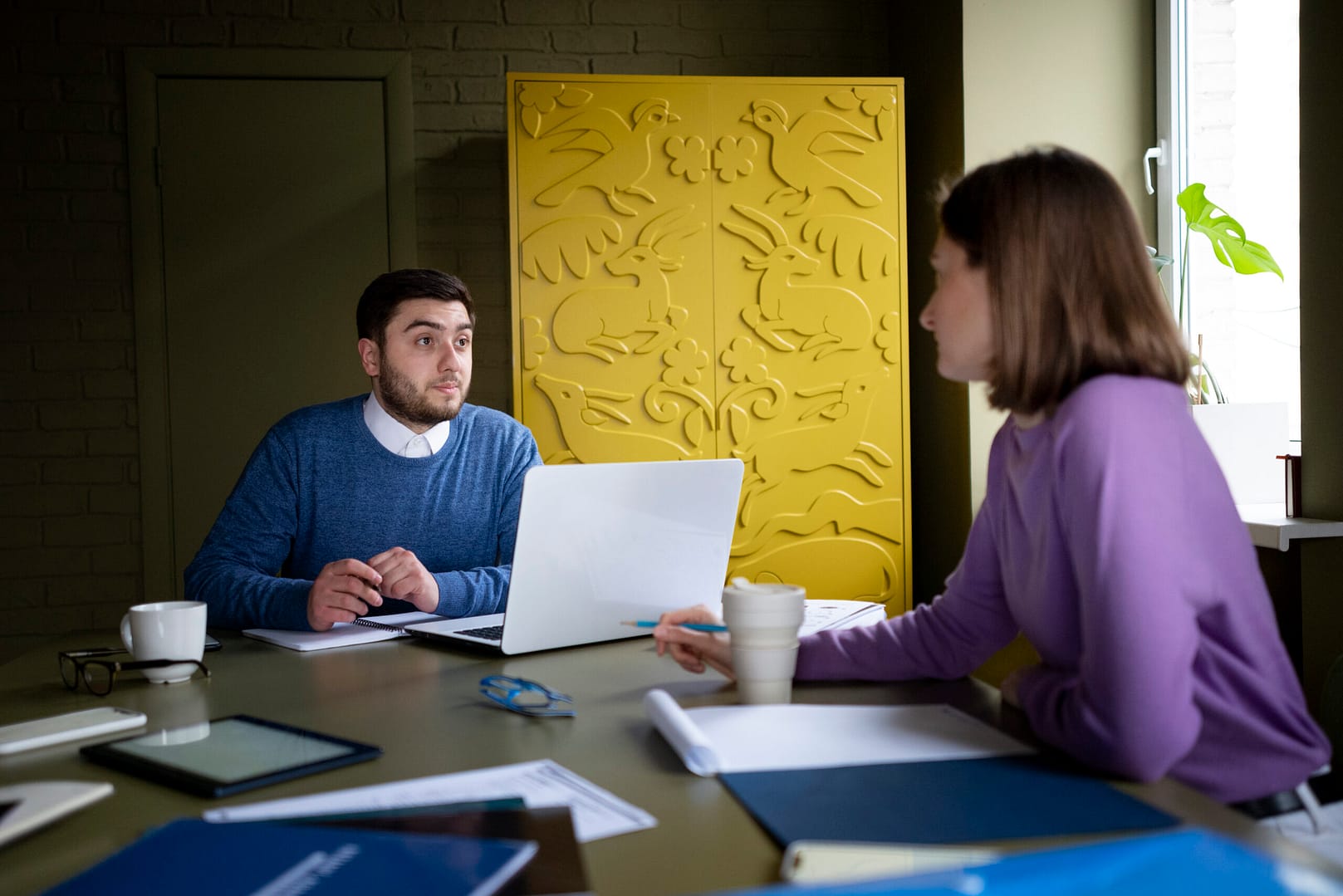 medium shot people chatting work scaled