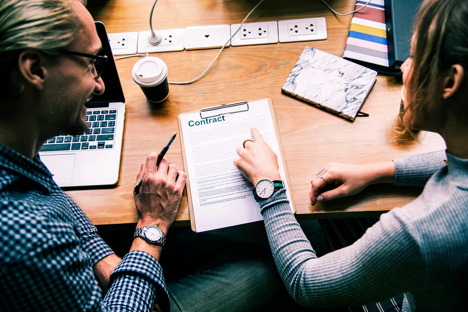business people discussing contract scaled