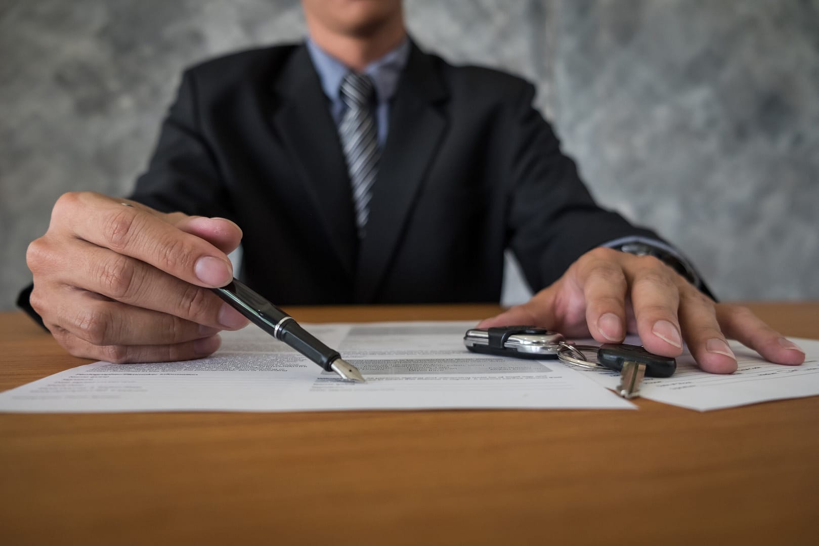 transportation ownership concept customer salesman with car key scaled