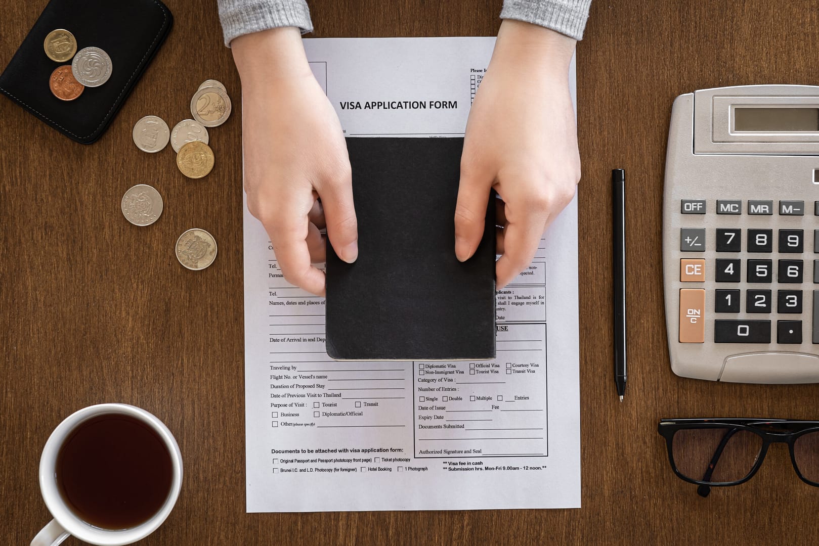 visa application form wooden table visa processing registration flat lay scaled