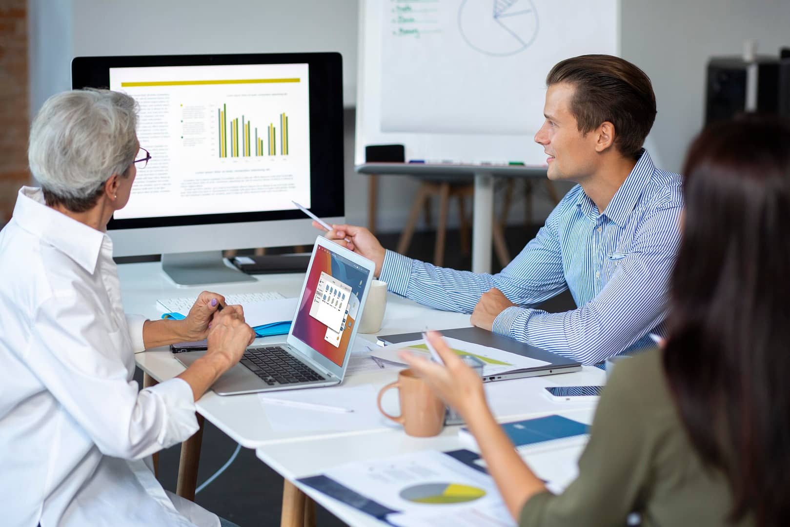 people using digital device while meeting 1 scaled