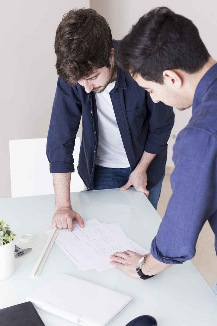 men discussing project office 1 1 1